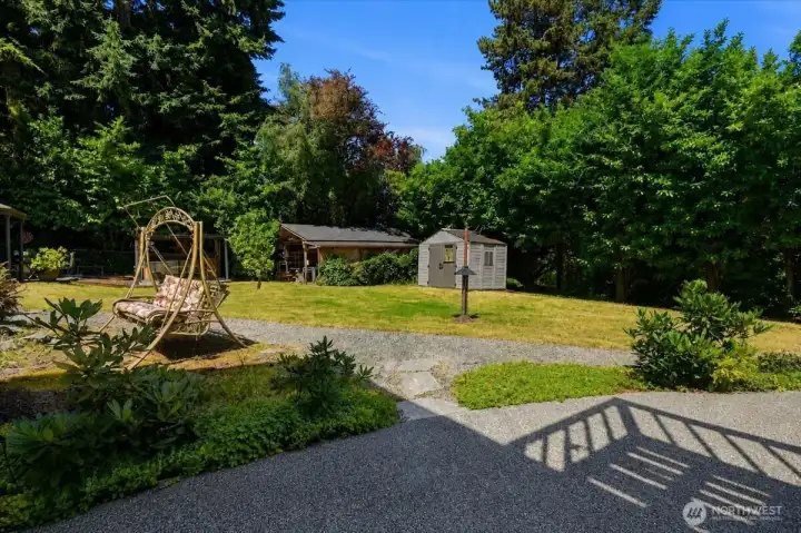 There are out buildings and a large patio perfect for entertaining.