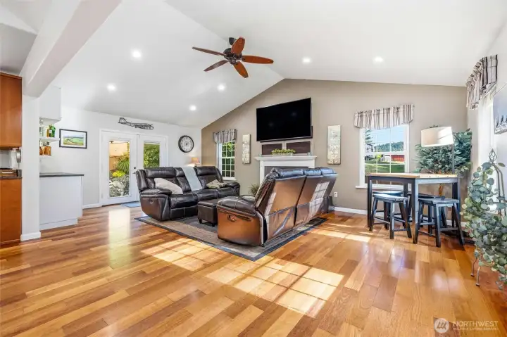 Open-concept living with a cozy fireplace and abundant natural light. Open-concept living with a cozy fireplace and abundant natural light.