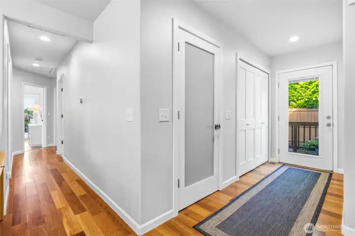 A warm and inviting entry with rich hardwood floors and clean lines A warm and inviting entry with rich hardwood floors and clean lines