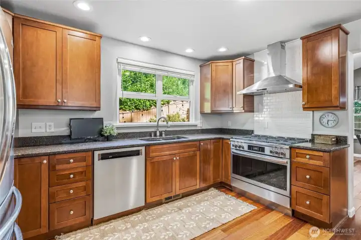 Chef-inspired kitchen with stainless appliances and abundant storage. Chef-inspired kitchen with stainless appliances and abundant storage.