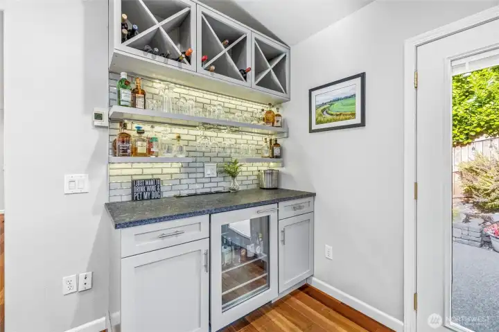 Raise a glass at this beautifully designed wet bar and built-in wine storage. Raise a glass at this beautifully designed wet bar and built-in wine storage.