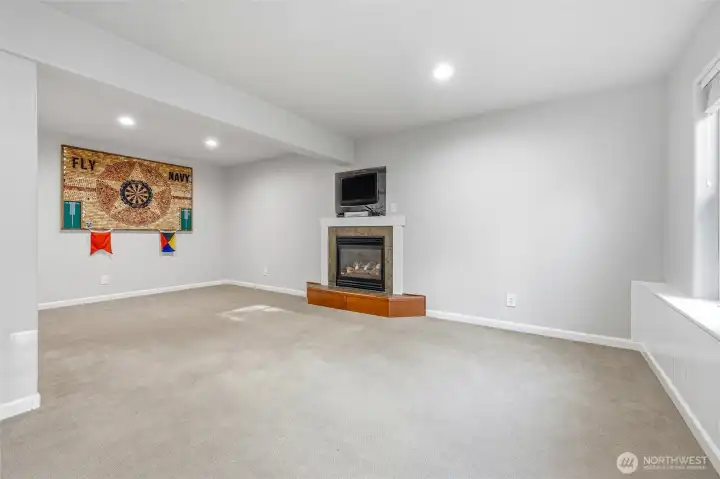 Cozy fireplace anchors this bright and versatile family room. Cozy fireplace anchors this bright and versatile family room.