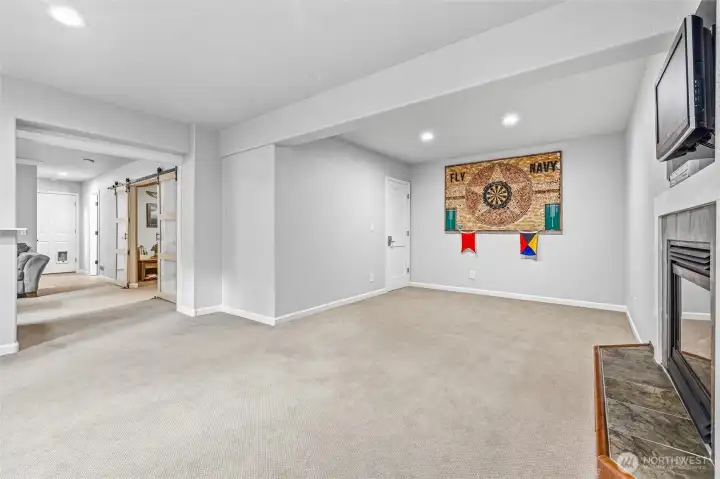 Expansive rec room ready for games, movies, and relaxation. Expansive rec room ready for games, movies, and relaxation.