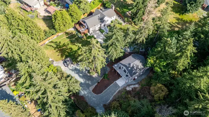 A private retreat with a main home, guest home, and park-like grounds. A private retreat with a main home, guest home, and park-like grounds.
