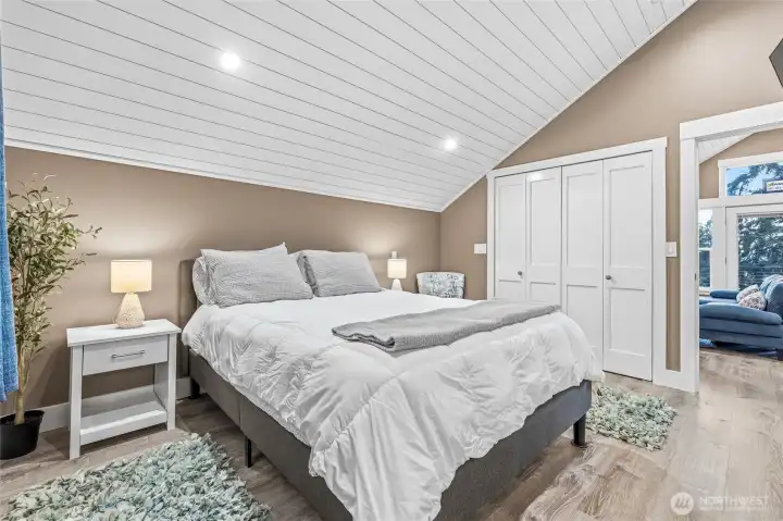 Peaceful ADU bedroom with vaulted ceilings and abundant natural light. Peaceful ADU bedroom with vaulted ceilings and abundant natural light.