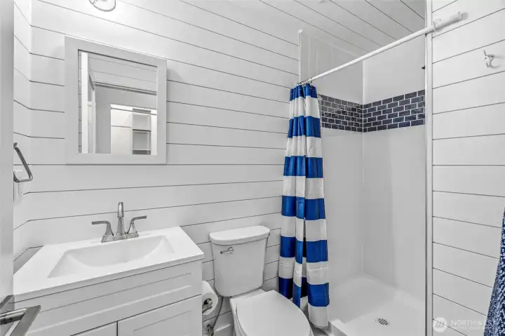 Stylish bath featuring classic shiplap and modern finishes. Stylish bath featuring classic shiplap and modern finishes.