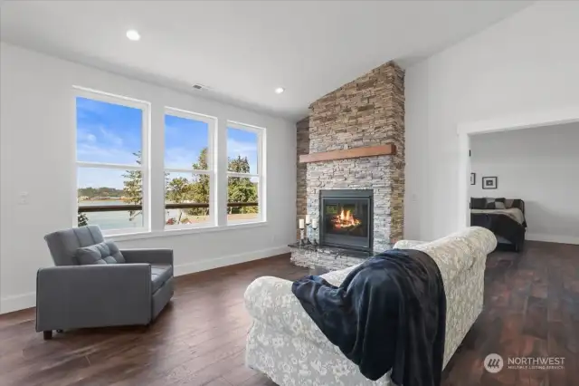 Spacious living room with cozy gas fireplace.