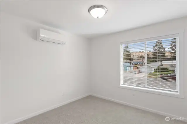 Second bedroom with individually-controlled mini split for heat and air conditioning.