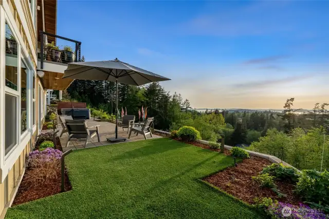 This inviting patio seating area is the perfect spot to relax and enjoy peaceful views of the islands, gardens, and surrounding landscape.