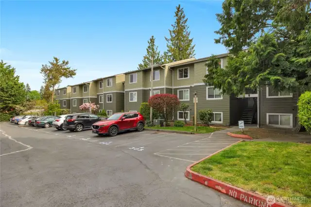 Unit A-305 has one dedicated parking space right in front of the building and stairs to unit