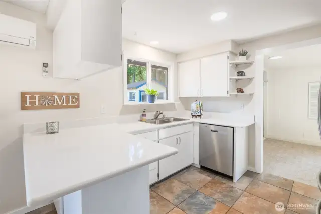 Kitchen with bonus/family room beyond