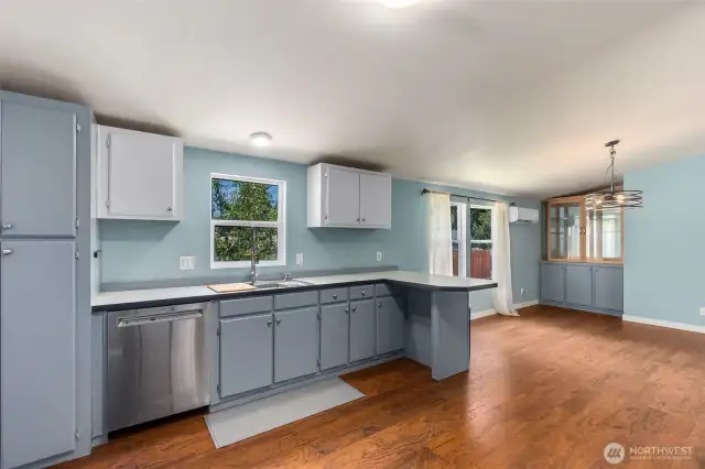 An abundance of storage and plenty of space for cooking together.  Built in china hutch to the left.