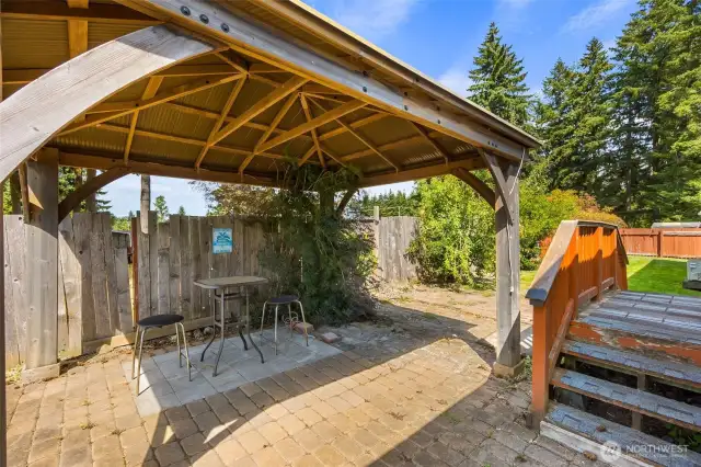 Back patio with covered area perfect for summer bbqs.