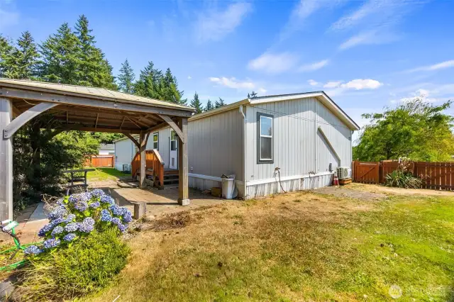 Another view of fully fenced back yard of the home.