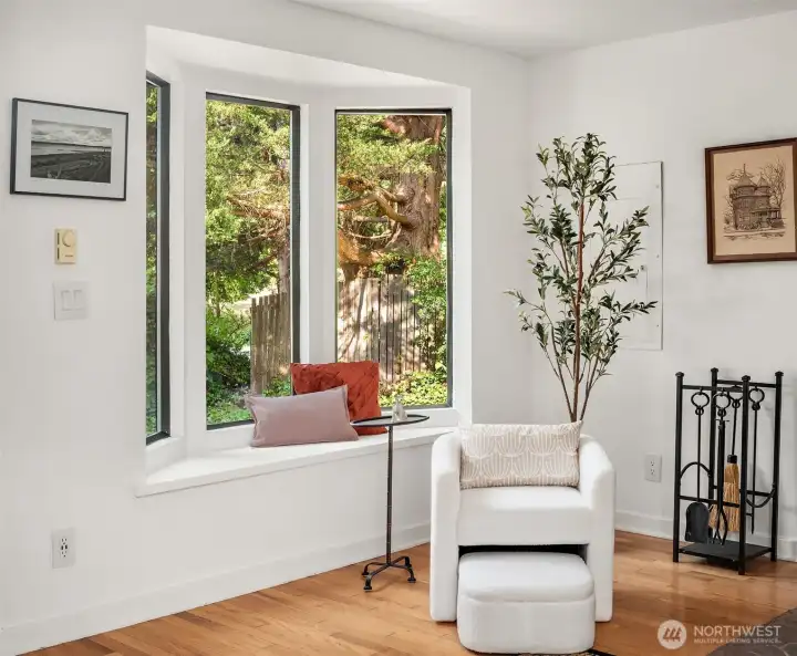 Window seat in the living room looks out on the entry garden.