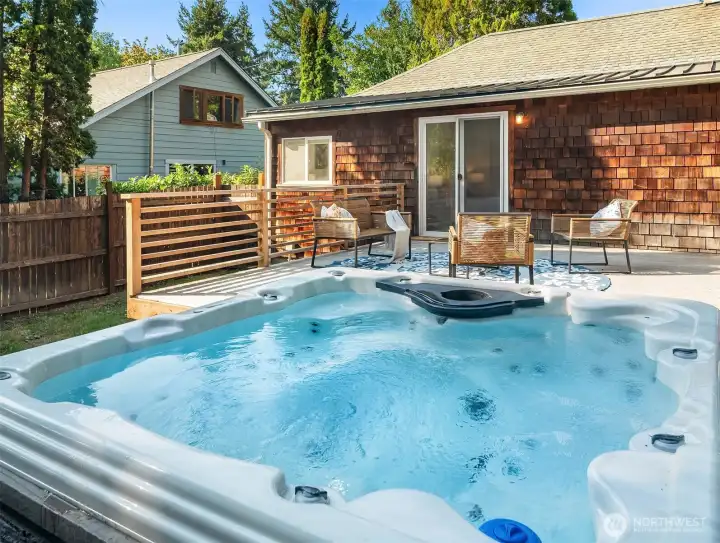 Hot tub on deck -- evening soaks are steps away.