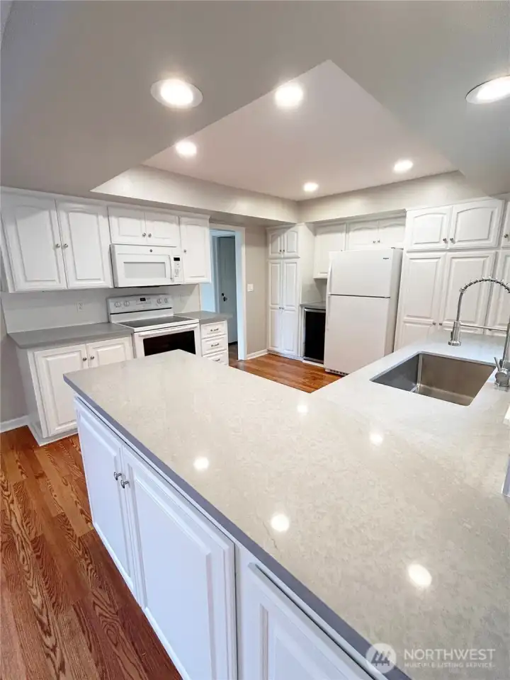 Did we mention the cabinet space! Bright and open and great for entertaining, check out the wine fridge!