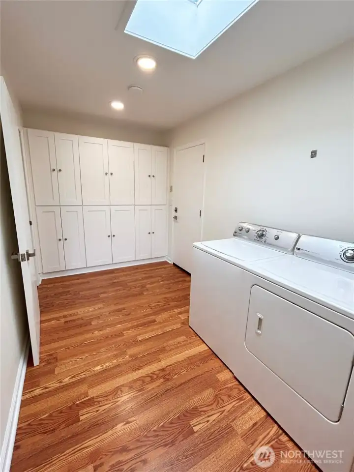 Mudroom over built-in storage, utility sink and additional full bath