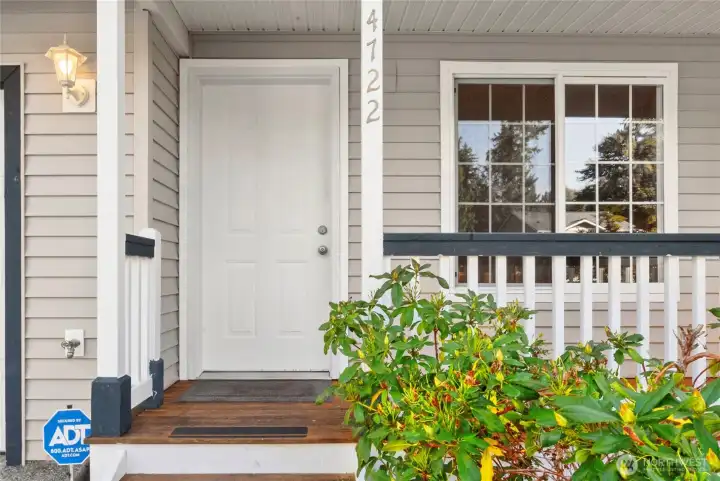 Perfect front porch for a rocking chair and a cup of coffee.