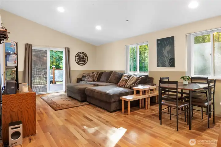 This living room is flooded with natural light and has access the to back deck.