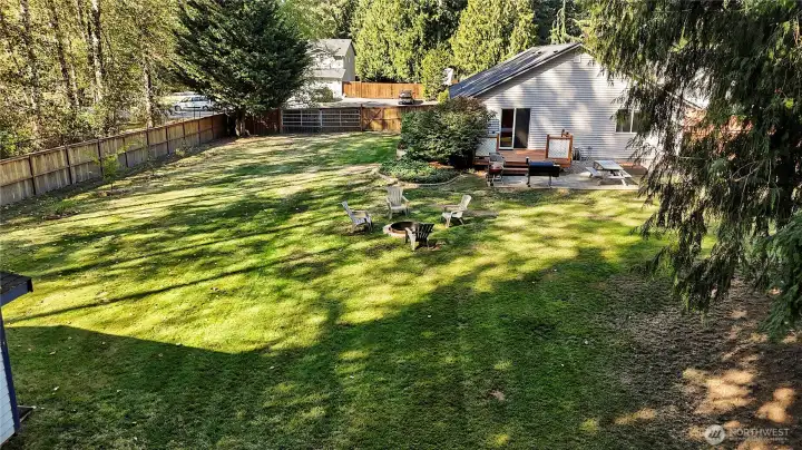 This level, fully-fenced, almost 1/2 acre yard is truly a little oasis.