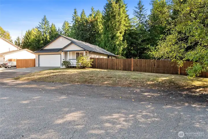 Large driveway and extra parking along front yard.