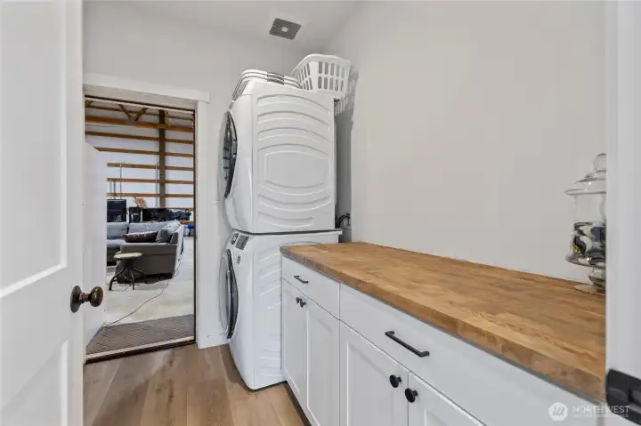 From kitchen area into the utility room, then into shope area