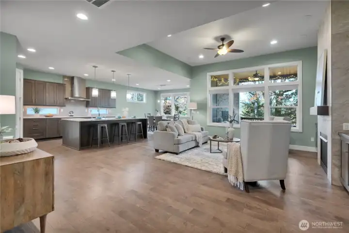 Great Room just a slider away from a large covered porch.  True Indoor-Outdoor living!  Note tray ceiling delineating living room area.