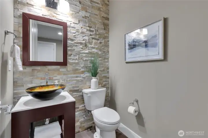 Powder room for guests easily accessed from Great Room.  9' ceilings, even in here!
