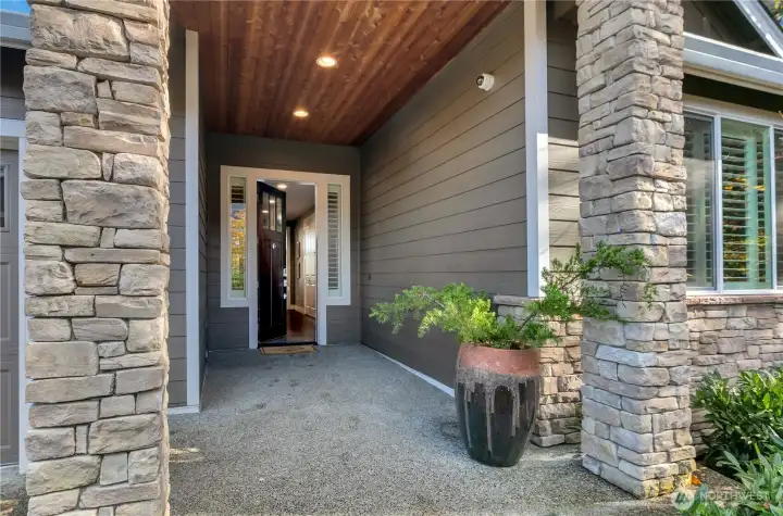 Thanks for taking a look!  Gracious stone-columned, covered entry with 8' door & sidelights with plantation shutters. Please reach out for any questions on anything!!