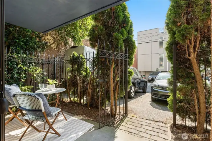 Gated entrance out to parking lot & alley