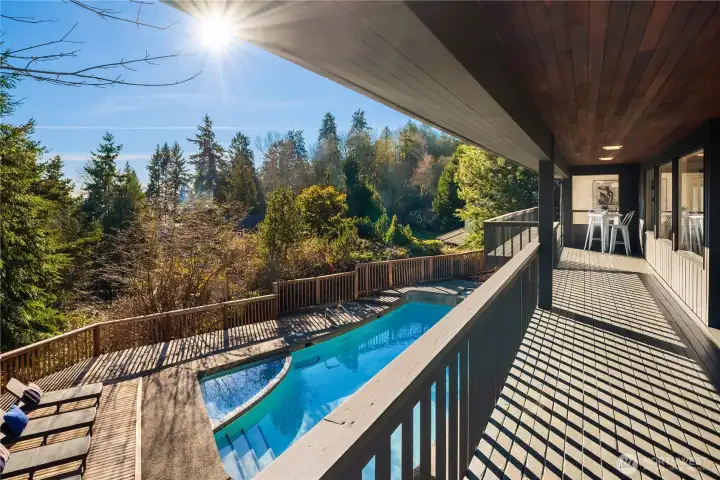 Sited on a 10,930 sf lot this home boasts full length decks, peek lake views and even a surprise view of Mt Rainier!
