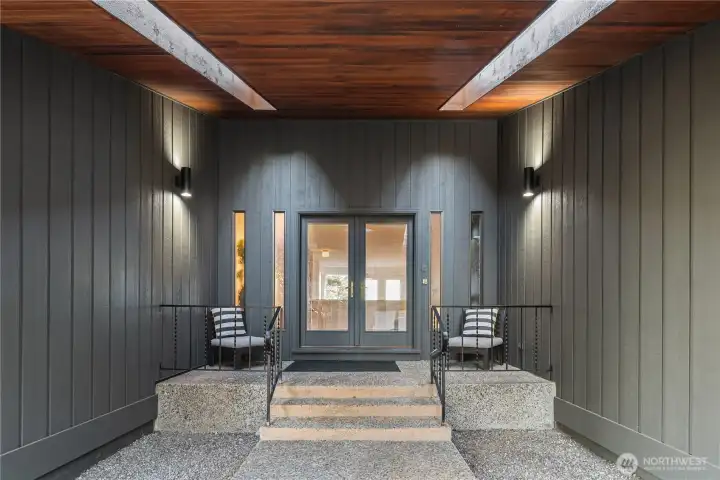 The spacious covered entry features double doors, cedar soffits and overhead skylights.