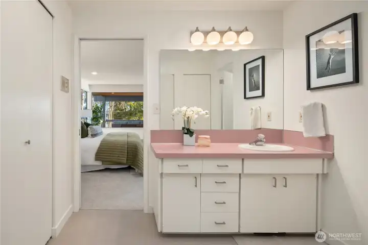 The en-suite features brand new flooring, wrap-around closets and a separate room to the refinished tile shower and water closet.