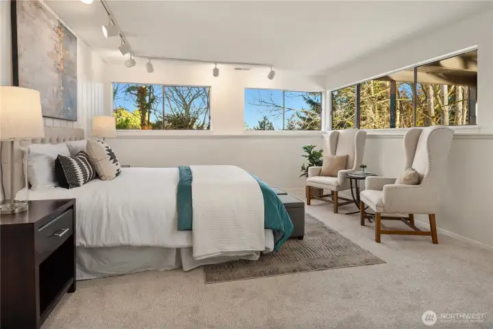 The fourth bedroom located downstairs features windows on 2 walls and amazing space.