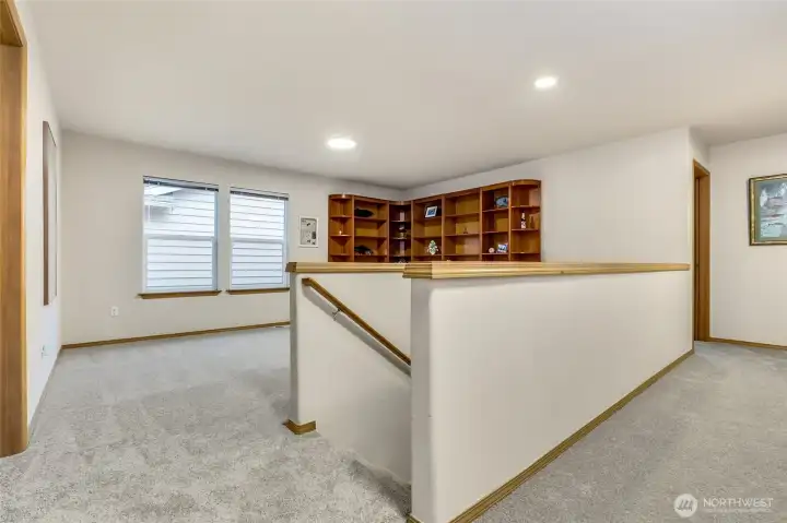 Upstairs landing room perfect for flexible work or play space.