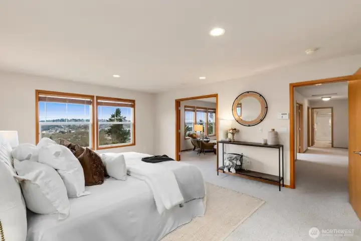 Primary suite offers fabulous views of downtown Renton, Lake WA & Seattle Skylne.