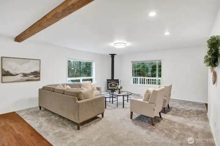 Living room with wood burning fireplace.