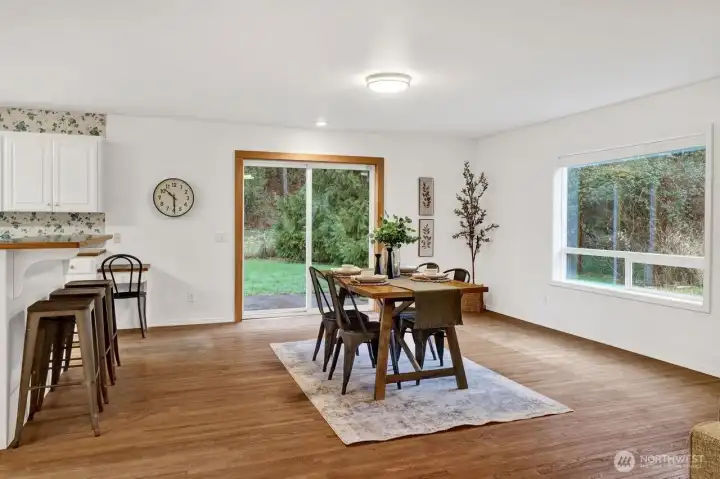 Dining room with a lot of space and light.