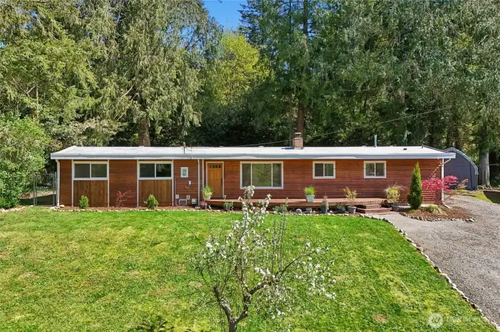 Charming curb appeal with mature landscaping.