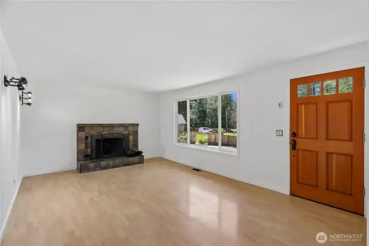 A cozy fireplace in the living room anchors the space.