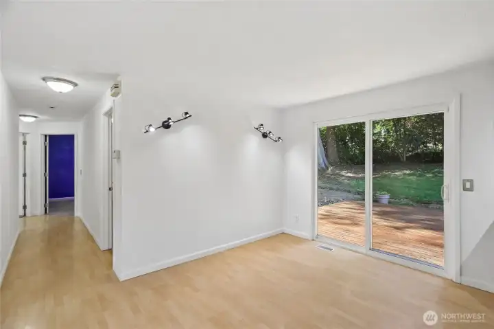 Dining area conveniently located off the kitchen with a sliding door that opens to the backyard deck.