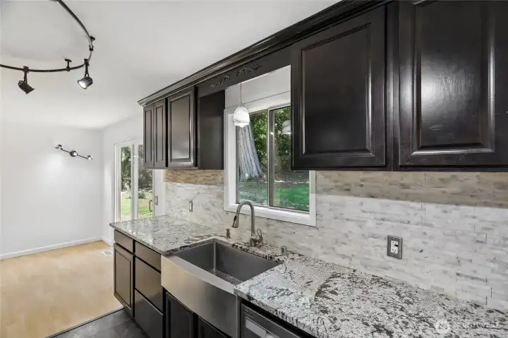 Functional kitchen with stainless steel appliances.
