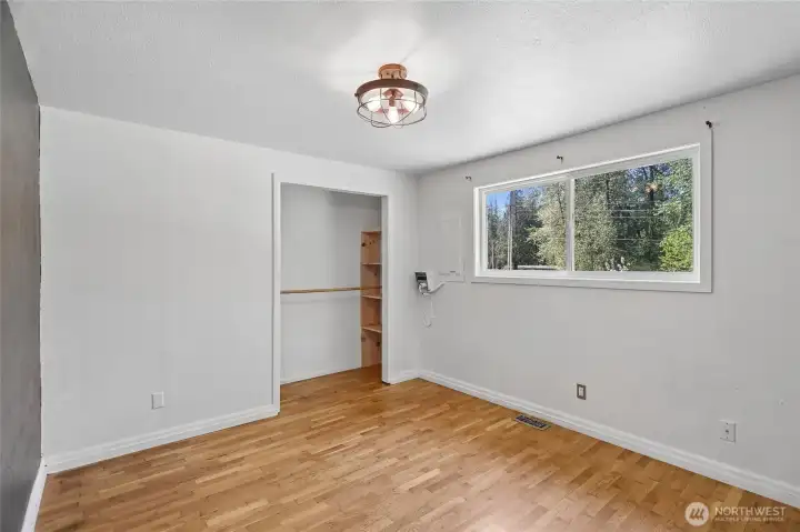Secondary bedroom with bright window.