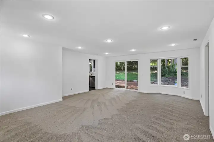 Spacious family room just off the kitchen with direct access to the backyard deck. A bay window adds charm and natural light.