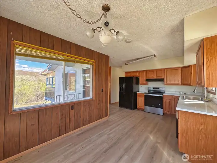 Kitchen features upgraded cabinetry paired with granite countertops
