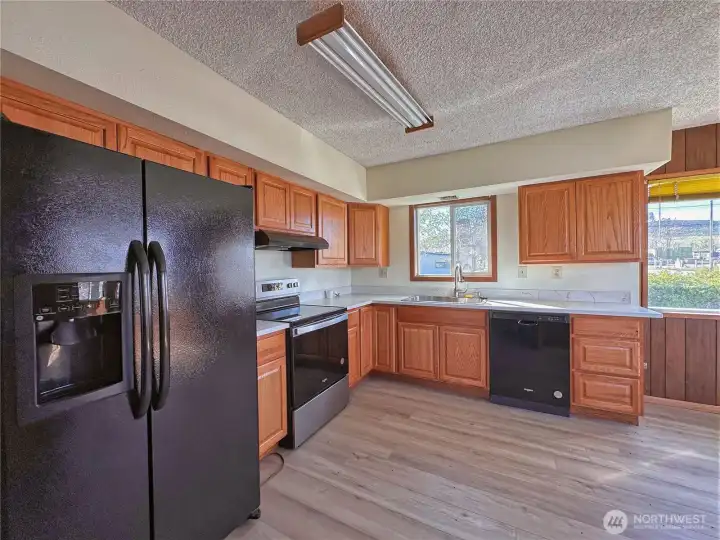 Newer appliances (refrigerator, stove/range, dishwasher) convey with sale