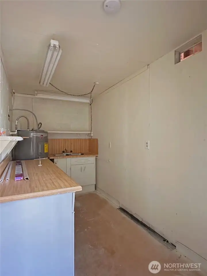 Utility room with sink in lower level