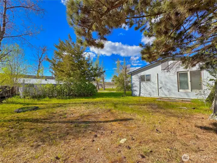 Private side yard off primary bedroom would be a great spot for a small deck and your hot tub installation