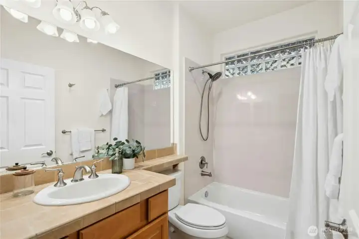 Full bathroom adjacent to second bedroom.